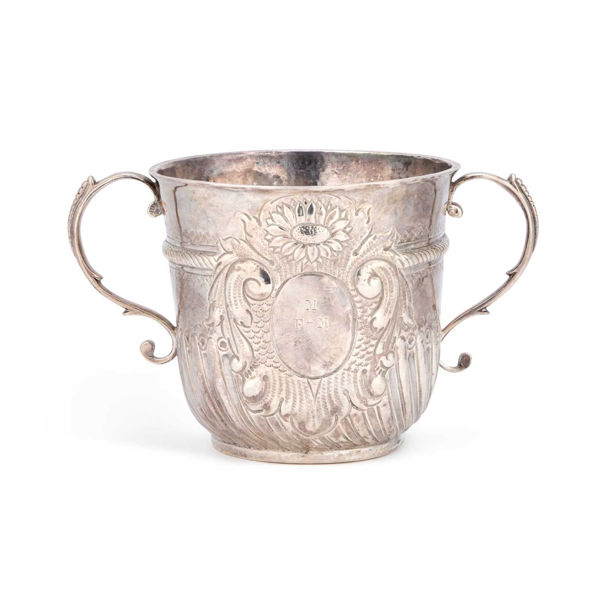 A QUEEN ANNE SILVER TWO-HANDLED PORRINGER London 1709, of circular form ...