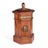 A CARVED MAHOGANY HEXAGONAL PILLAR LETTER BOX