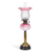 A VICTORIAN CRANBERRY AND OPAQUE GLASS OIL LAMP