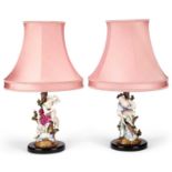 A PAIR OF CONTINENTAL PORCELAIN FIGURAL TABLE LAMPS