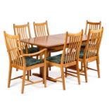 ERCOL A WINDSOR ELM TABLE AND SIX CHAIRS