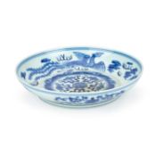 A CHINESE BLUE AND WHITE ‘PHOENIX AND DRAGON’ DISH