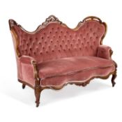 A VICTORIAN WALNUT AND UPHOLSTERED SETTEE CIRCA 1860
