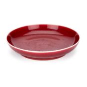 A CHINESE LANGYAO-TYPE RED GLAZED DISH