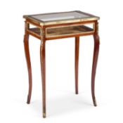 A LATE 19TH CENTURY GILT-METAL MOUNTED MAHOGANY BIJOUTERIE TABLE