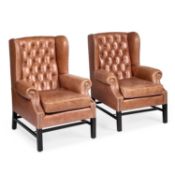 A PAIR OF BROWN LEATHER UPHOLSTERED WING-BACK ARMCHAIRS