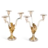 A PAIR OF ELIZABETH II SILVER AND PARCEL-GILT LIMITED EDITION CANDELABRA