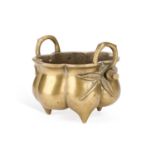 A CHINESE BRONZE TRIPOD CENSER