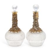 A PAIR OF 19TH CENTURY GILT-METAL MOUNTED CUT-GLASS DECANTERS