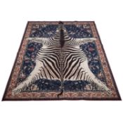 A RUGGABLE ‘ZEBRA’ WASHABLE FLOOR RUG