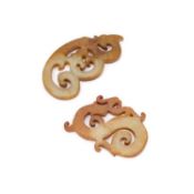 TWO CHINESE CELADON AND RUSSET JADE ‘DRAGON’ PLAQUES