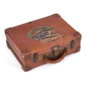 A 1930S LEATHER SUITCASE WITH CUNARD LINE LABEL