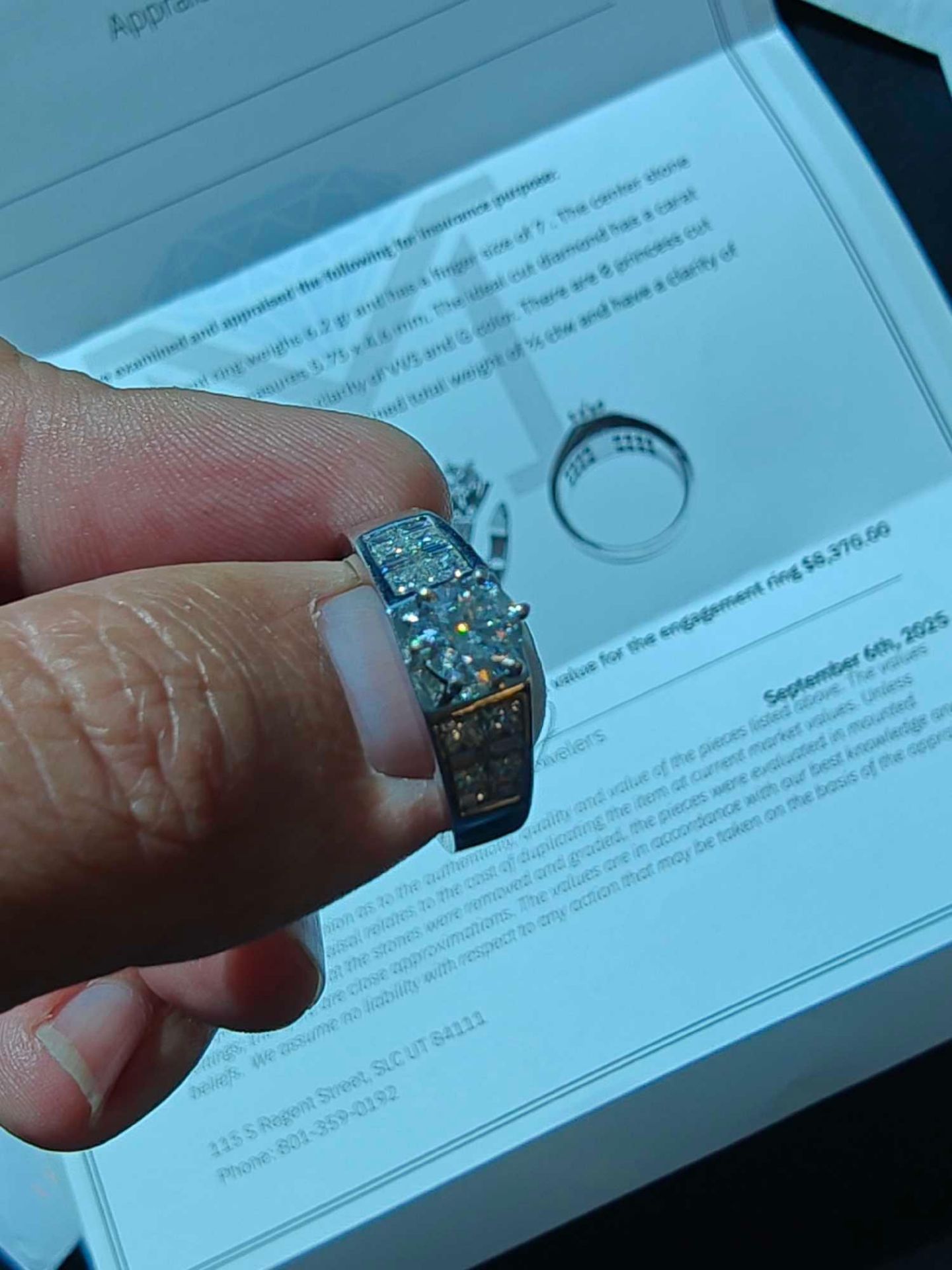 14kt white gold engagement ring, size .75 carat with 8 princess and 8 baguette side cuts with apprai