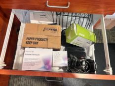 Misc supplies in cabinets and two desk chairs