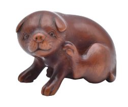 A WOOD NETSUKE OF A PUPPY, EDO PERIOD (1615-1868), EARLY/MID 19TH CENTURY