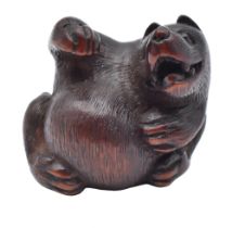 KOKEI, KUWANA, ISE PROVINCEA WOOD NETSUKE OF A TANUKI DO PERIOD (1615-1868), EARLY 19TH CENTURY