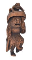 Ω HIDETOMOA WOOD NETSUKE OF SHOKI AND ONI (DEMON), EDO PERIOD (1615-1868), 19TH CENTURY