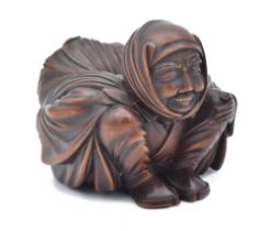 λ RYUKEIA LARGE WOOD OKIMONO (TABLE ORNAMENT) OF A MAN, MEIJI ERA (18168-1912)