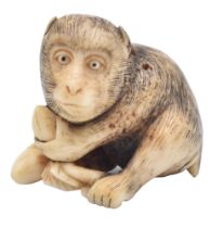 A STAG-ANTLER NETSUKE OF A MONKEY, MEIJI ERA (1868-1912), LATE 19TH/EARLY 20TH CENTURY