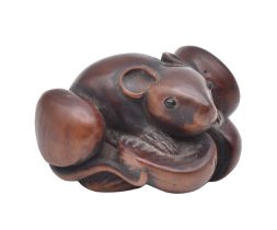 A WOOD NETSUKE OF A RAT CLAMBERING OVER SIX CHESTNUTS EDO PERIOD (1615-1868), 19TH CENTURY