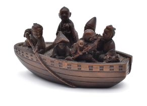 KEISAIA WOOD NETSUKE OF A FERRYBOAT, EDO PERIOD (1615-1868), 19TH CENTURY