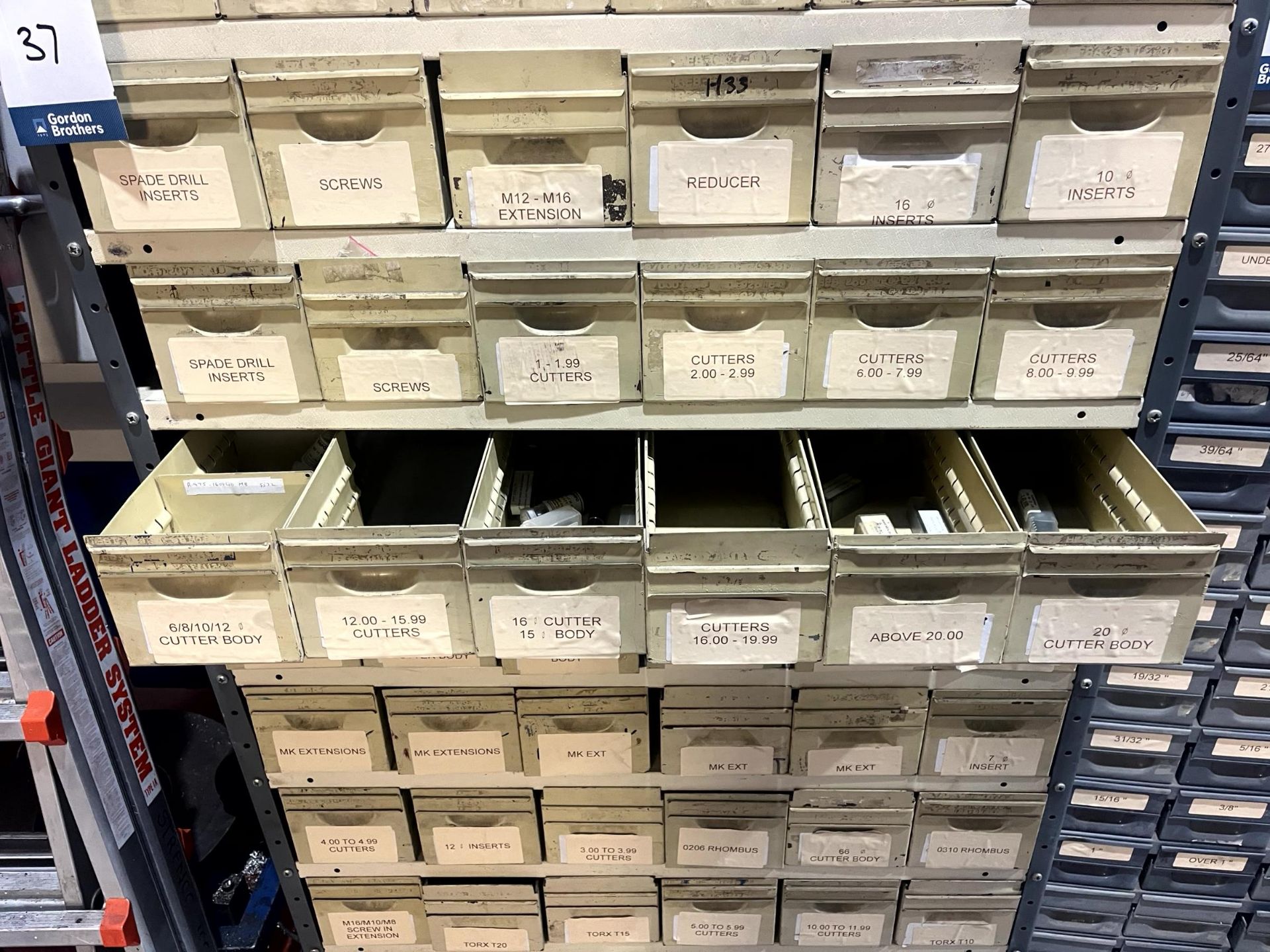 Two multi-drawer storage units with consumable contents and various ...