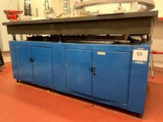 Granite topped surface table, bed dimensions 1820mm x 915mm, mounted on metal storage unit -