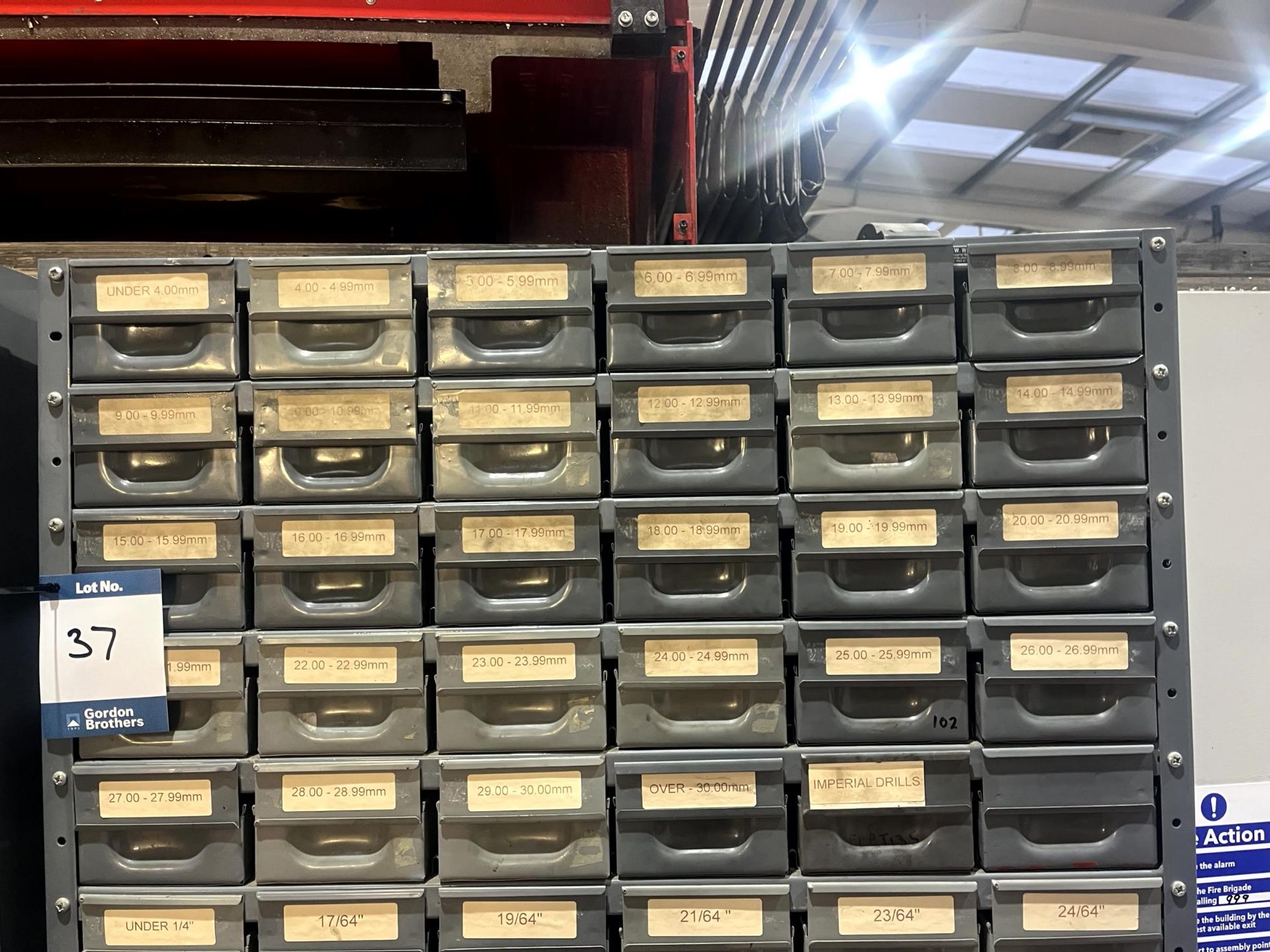 Two multi-drawer storage units with consumable contents and various ...