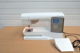Husqvarna Viking Designer Topaz 30 Sewing Machine With Plastic Cover.