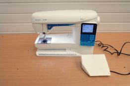 Husqvarna Viking Opal 650 Sewing Machine With Plastic Cover.