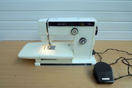 Riccar 9160 Super Stretch Sewing Machine With Plastic Cover.