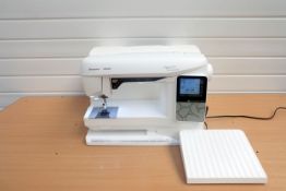 Husqvarna Viking Opal 690Q Sewing Machine With Plastic Cover.