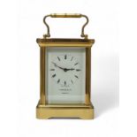 Garrard & Co. 20th century brass four glass carriage clock, the dial bearing Roman numerals,