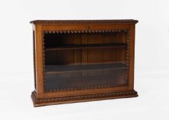 A carved walnut glazed counter-top display cabinet