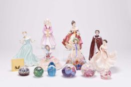 Royal Doulton, Coalport and Royal Worcester ladies together with glass paperweights