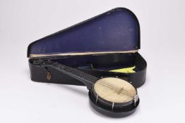 A cased 'Jolli Joe' alloy banjolele