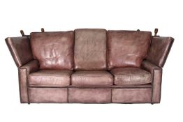 A knole type leather three-seater sofa