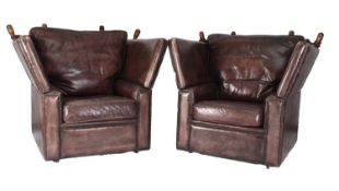 A pair of knole type leather armchairs