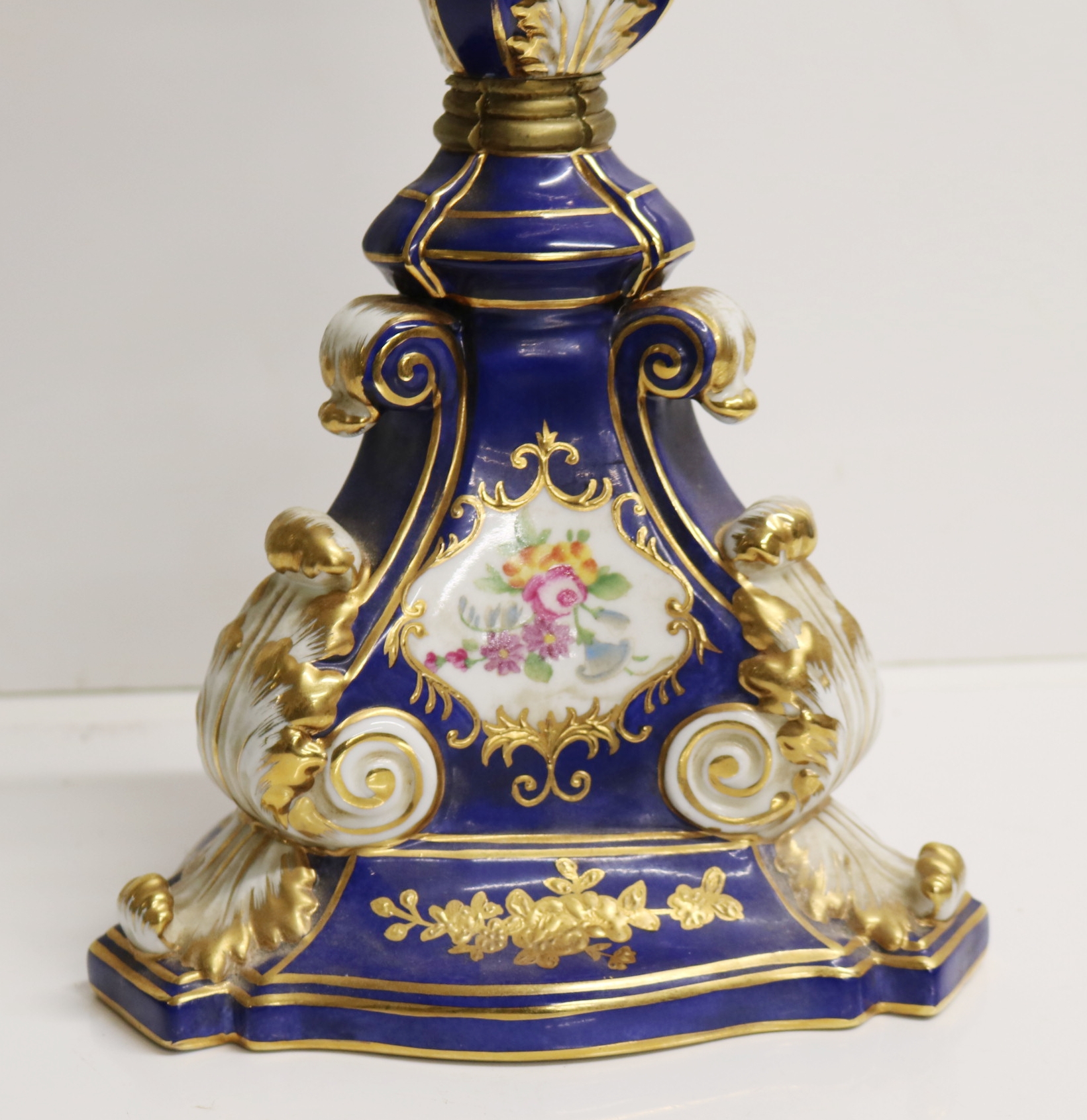 A SEVRES STYLE PORCELAIN AND GILT METAL FOUR BRANCH CANDLEABRA with ...