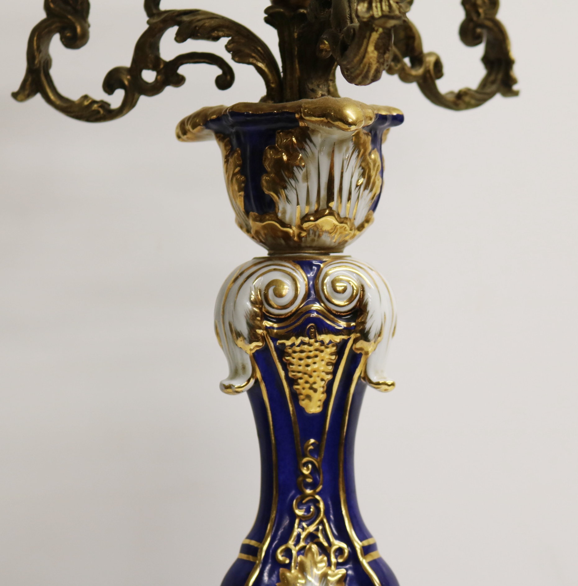 A SEVRES STYLE PORCELAIN AND GILT METAL FOUR BRANCH CANDLEABRA with ...