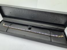 APPROX 8.00ct TANZANITE TENNIS BRACELET SET IN 9ct GOLD