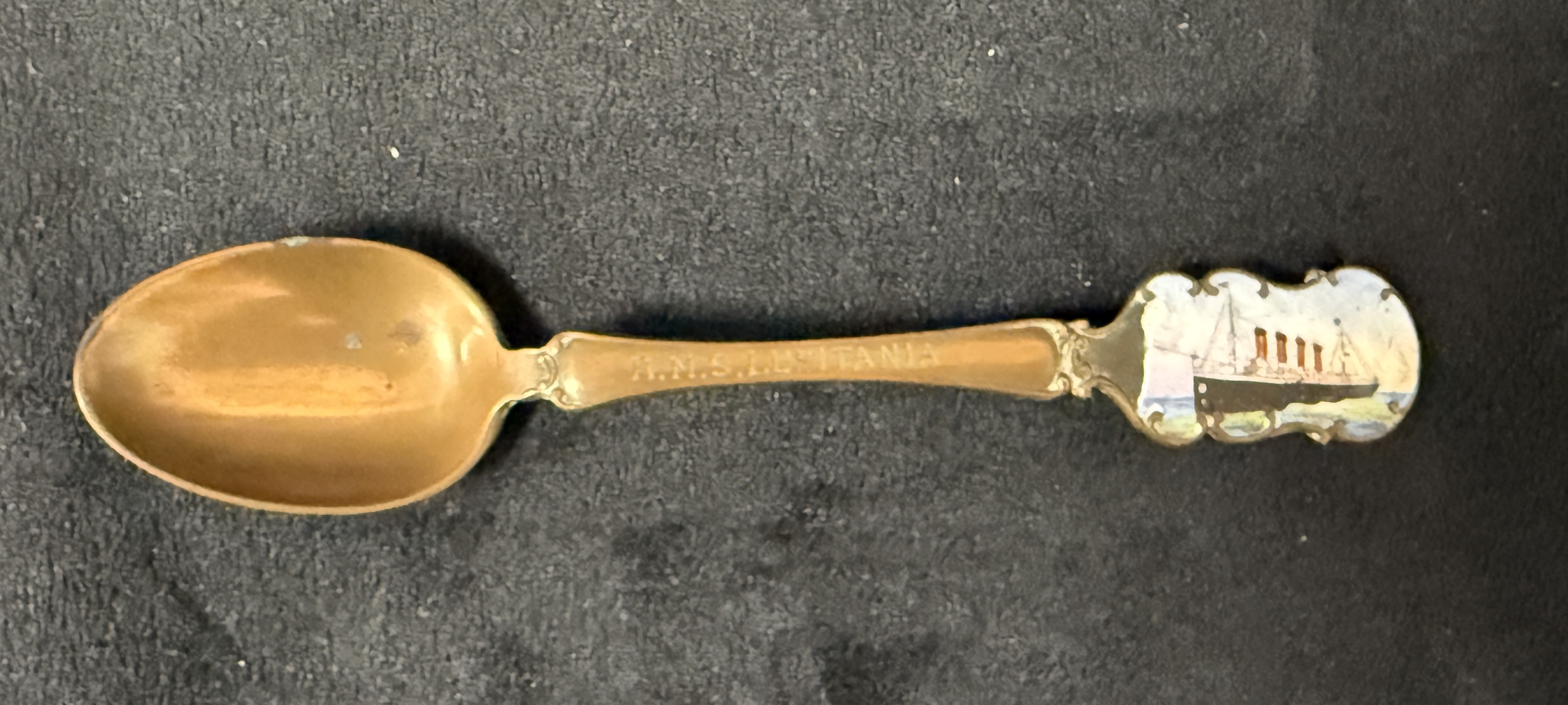 R.M.S. LUSITANIA: Rare silver plated tea spoon with enamel image of the ill-fated liner to the tip o