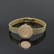 CHRIST Damenarmbanduhr in GG 585/000 mit Diamanten,