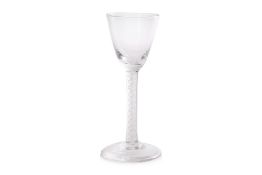 AN 18TH CENTURY ENGLISH AIR TWIST STEM WINE GLASS