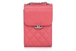 A CHANEL QUILTED CORAL CROSSBODY PHONE HOLDER BAG