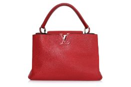 A LOUIS VUITTON RED CAPUCINES MM HANDBAG