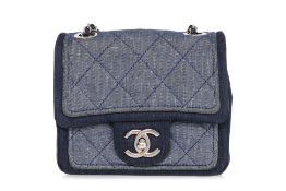 A CHANEL MINI QUILTED TWO-TONE DENIM CROSSBODY BAG