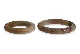 TWO CELADON JADE BANGLES