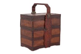 A WOVEN AND CARVED WOOD THREE TIER BASKET