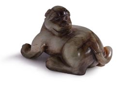 A JADE CARVING OF A MYTHICAL BEAST